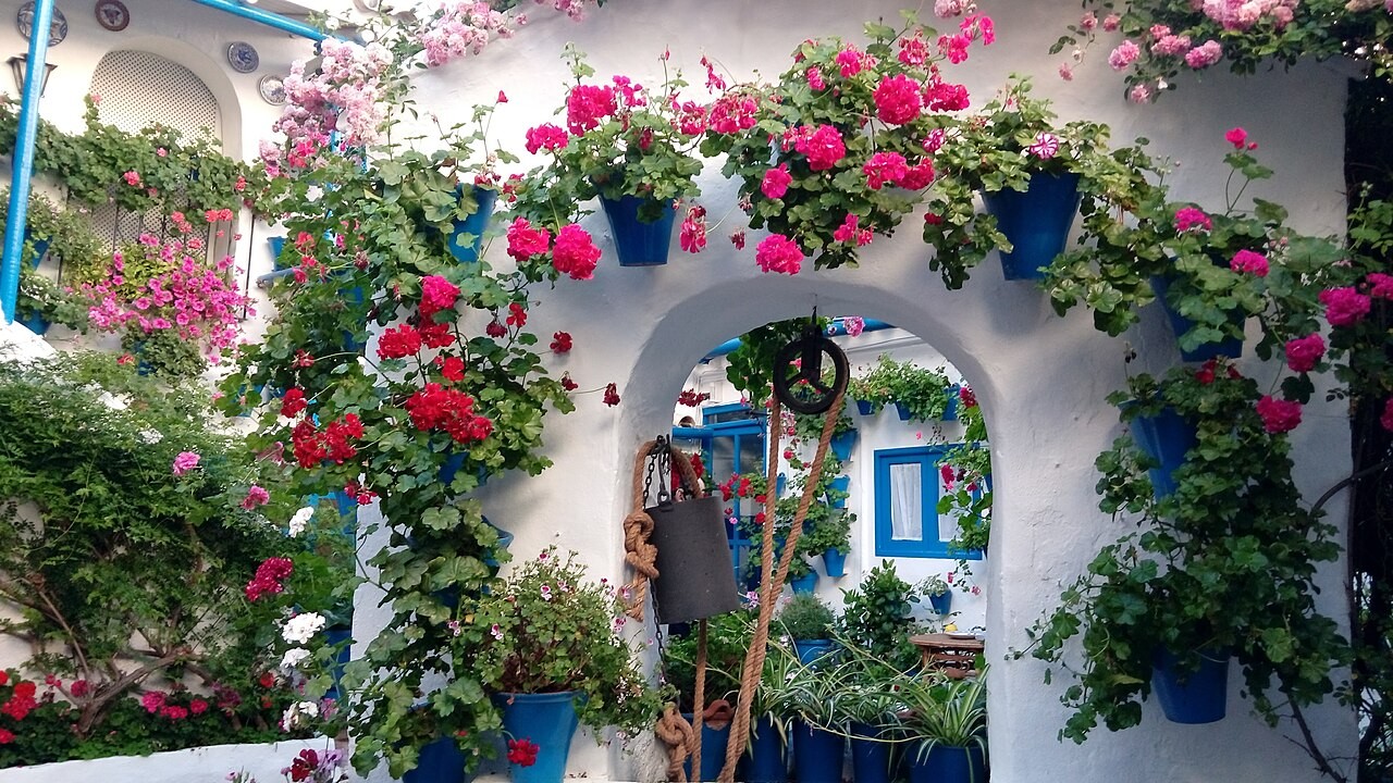 Pots and flowers surrounding a courtyard arch during Córdoba’s Patio Festival