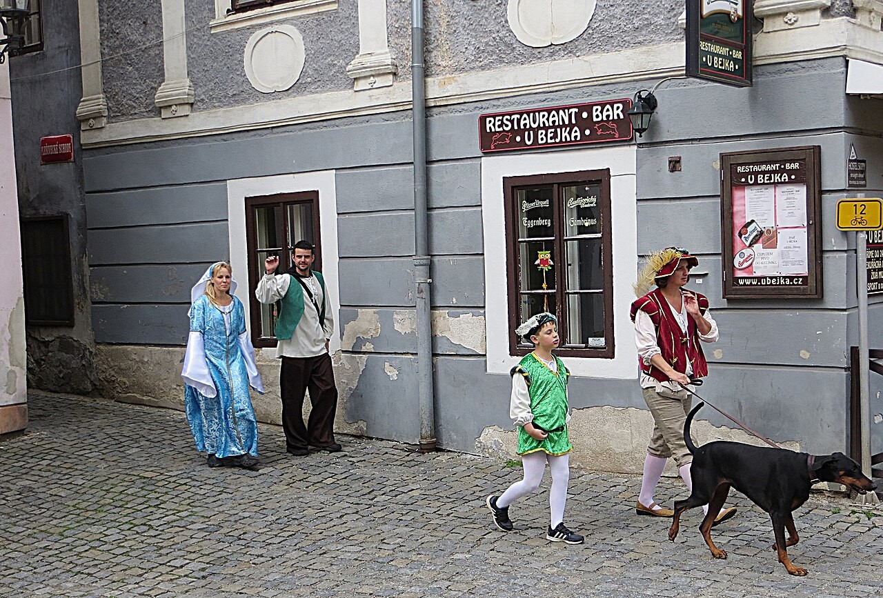 Costumed participants in Český Krumlov during the Five-Petalled Rose Festival